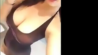 Big-Breasted Asian'S Sensual Striptease